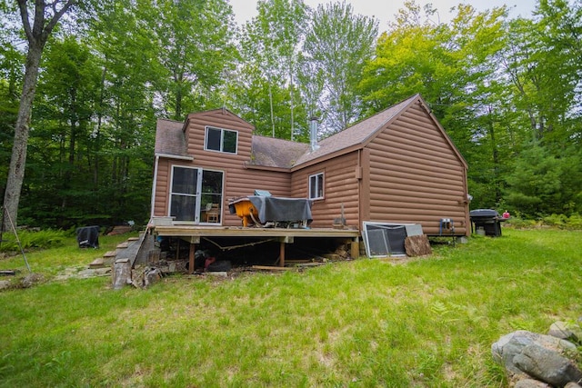 rear view of house with a lawn