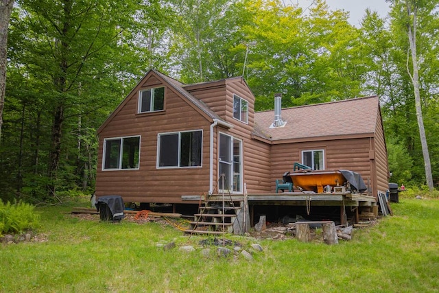 back of house with a lawn