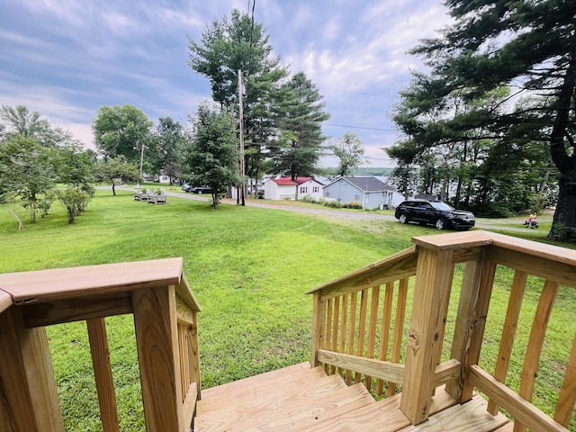 deck featuring a lawn