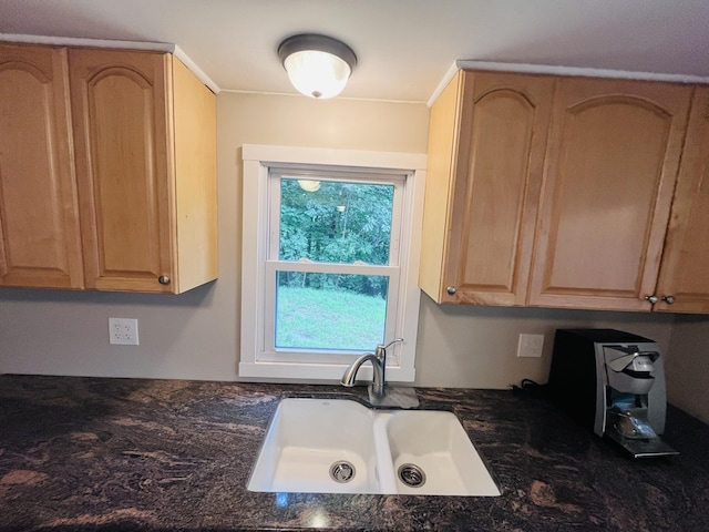 kitchen featuring light brown cabinetry and sink