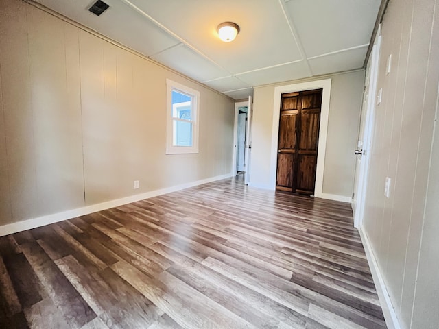 empty room with wood-type flooring