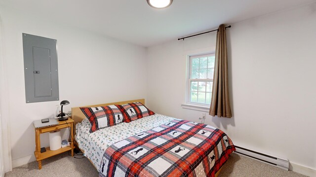 carpeted bedroom with baseboard heating and electric panel