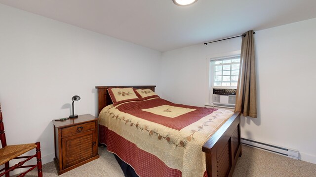 carpeted bedroom with cooling unit and baseboard heating