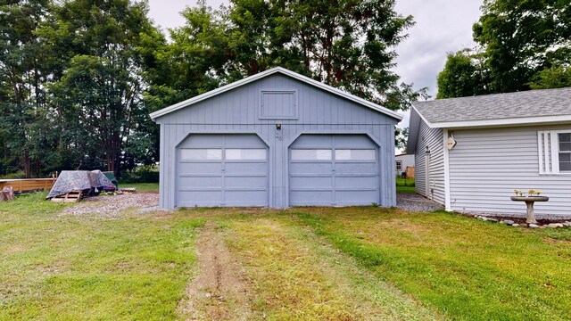 garage featuring a yard