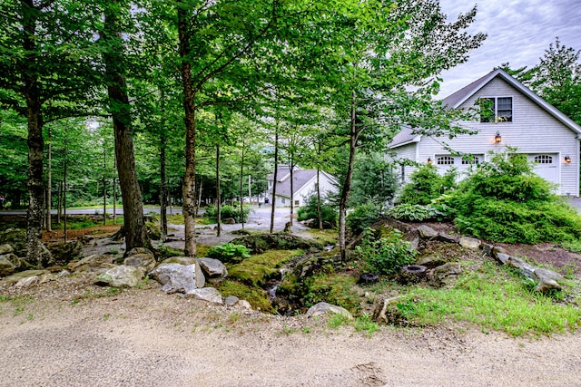 view of yard featuring a garage