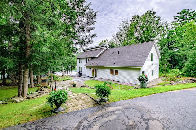 back of house featuring a yard