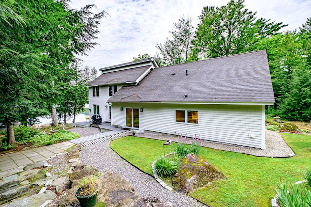 back of house with a yard and a patio area