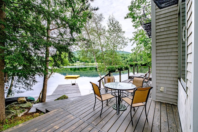 deck featuring a dock and a water view