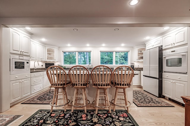 dining room with light hardwood / wood-style flooring