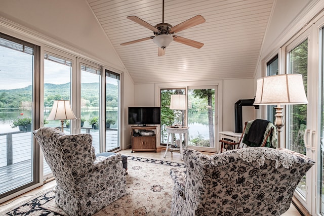 living room featuring lofted ceiling and ceiling fan