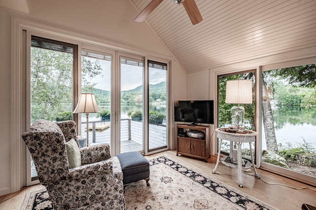 interior space featuring vaulted ceiling, wood ceiling, a wealth of natural light, and ceiling fan