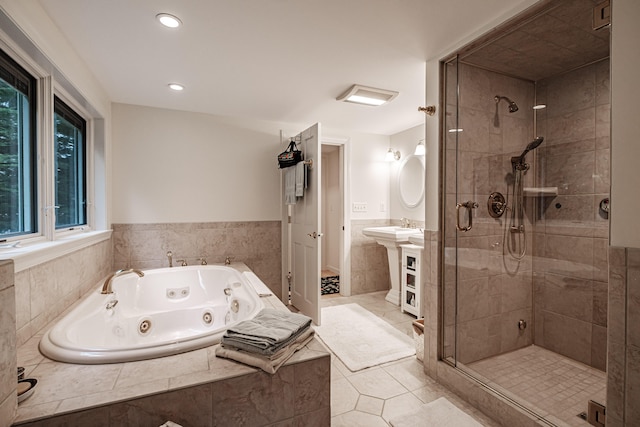 bathroom featuring sink, tile patterned floors, and walk in shower