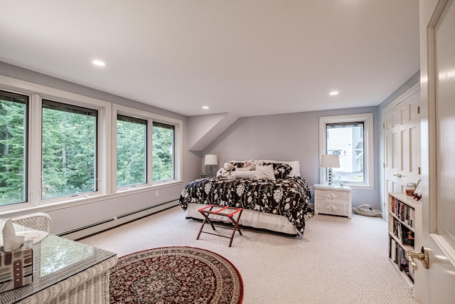 carpeted bedroom with baseboard heating