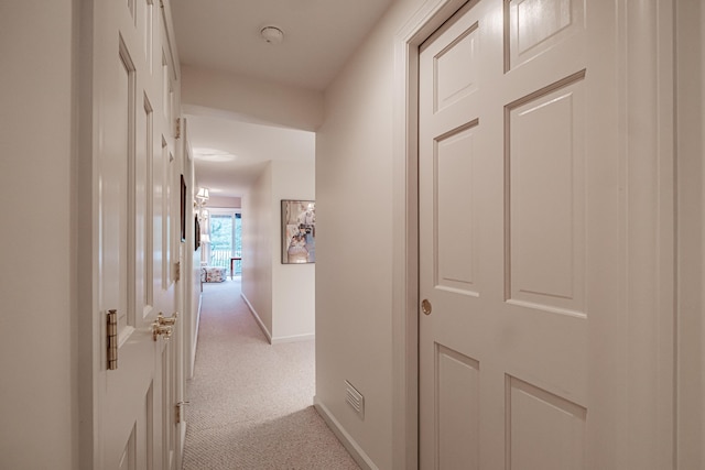 corridor with light colored carpet