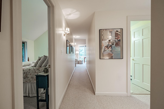 hallway featuring light carpet