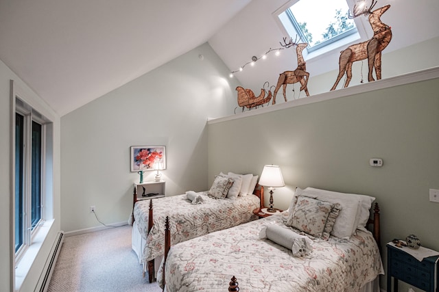 bedroom featuring multiple windows, carpet, vaulted ceiling with skylight, and a baseboard heating unit