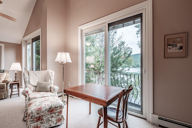 home office with light carpet, a baseboard radiator, and high vaulted ceiling