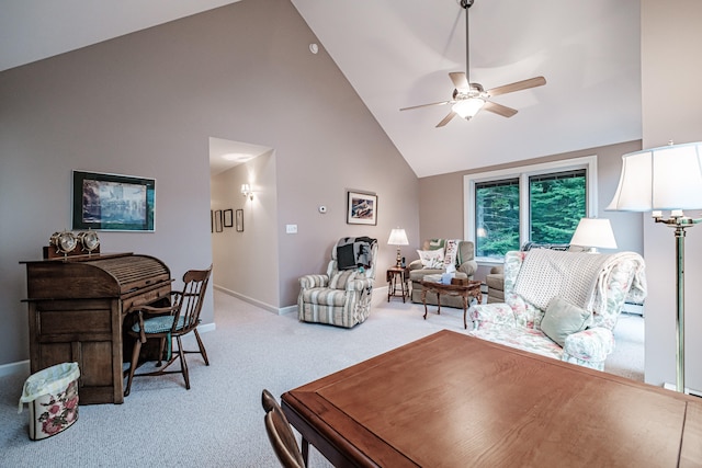 living room featuring carpet floors, high vaulted ceiling, and ceiling fan