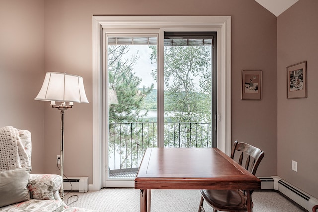 home office with a baseboard radiator, carpet flooring, and plenty of natural light