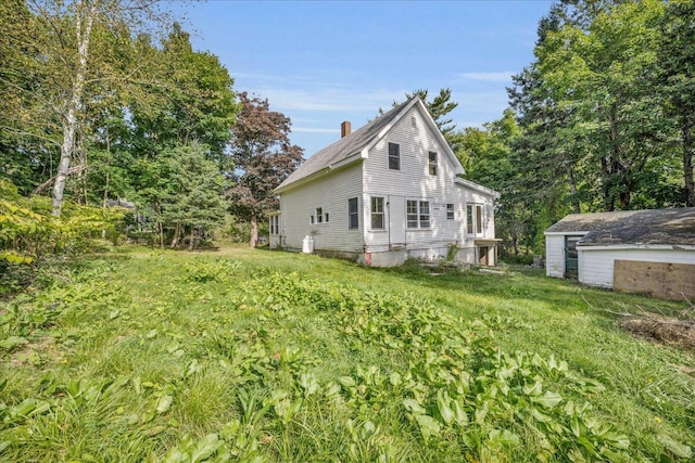 view of property exterior featuring a lawn