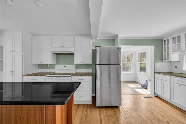 kitchen with white cabinetry, light hardwood / wood-style floors, white range with electric cooktop, and stainless steel fridge