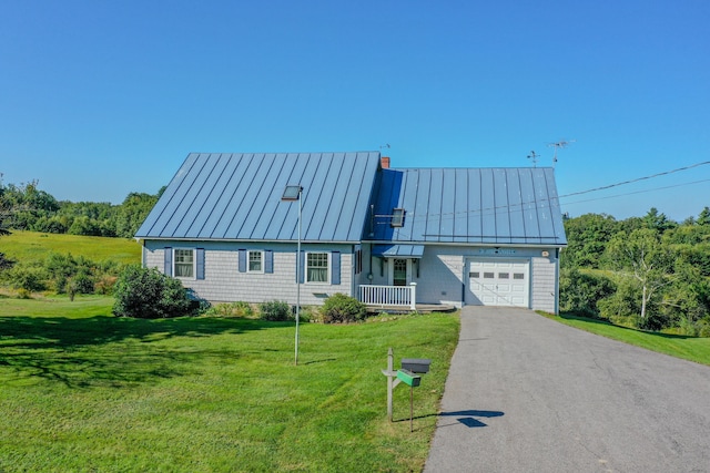 view of front of home featuring a front yard and a garage