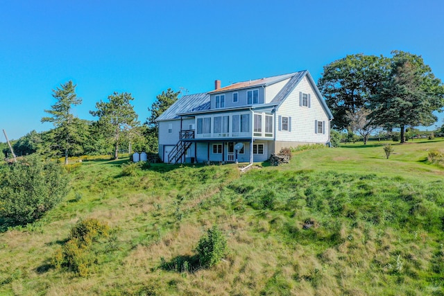 back of house with a yard and a deck