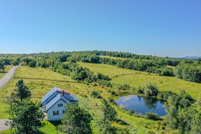 birds eye view of property with a water view and a rural view