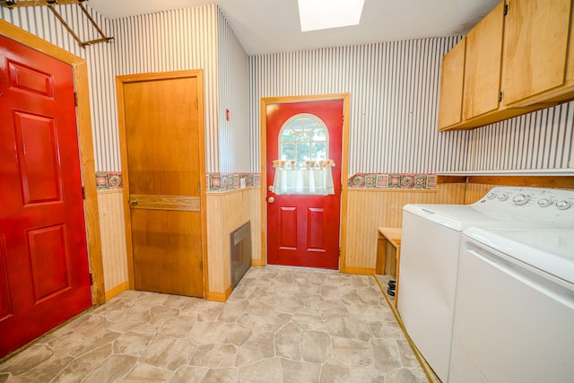 laundry area featuring cabinets and washing machine and dryer