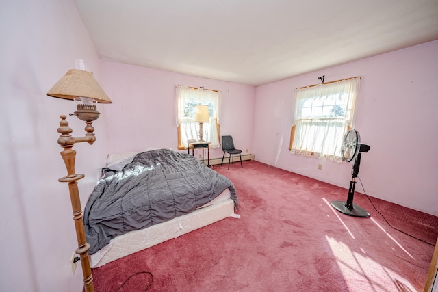 bedroom featuring a baseboard radiator and carpet