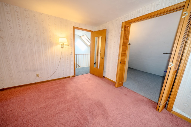 unfurnished bedroom with carpet flooring