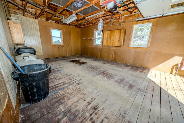 basement with hardwood / wood-style flooring