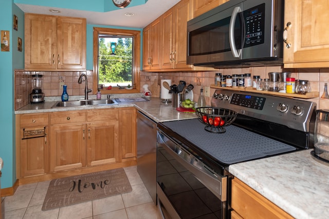 803 Lake Shore Rd, Madawaska, ME 04773 - kitchen featuring a sink, light countertops, appliances with stainless steel finishes, and tasteful backsplash