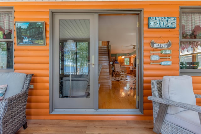 803 Lake Shore Rd, Madawaska, ME 04773 - view of exterior entry featuring faux log siding