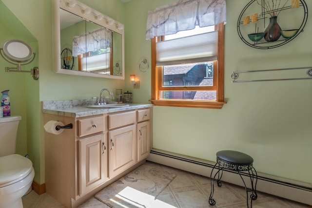 803 Lake Shore Rd, Madawaska, ME 04773 - half bath featuring toilet, vanity, and a baseboard heating unit