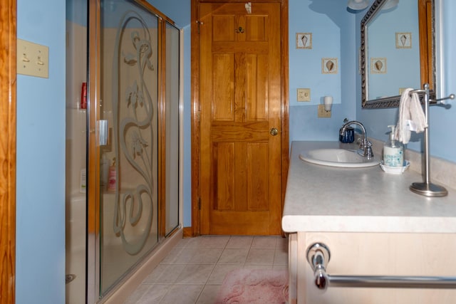 803 Lake Shore Rd, Madawaska, ME 04773 - bathroom featuring tile patterned flooring, vanity, and a stall shower