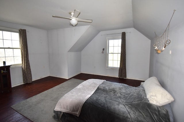 bedroom featuring ceiling fan, vaulted ceiling, and dark hardwood / wood-style flooring