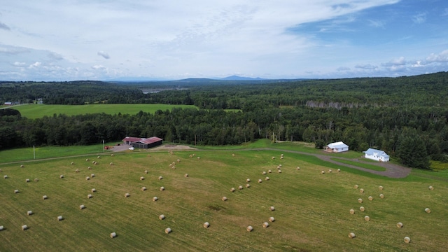 524A Ridge Rd, Oakfield, ME 04780 - birds eye view of property with a wooded view and a mountain view