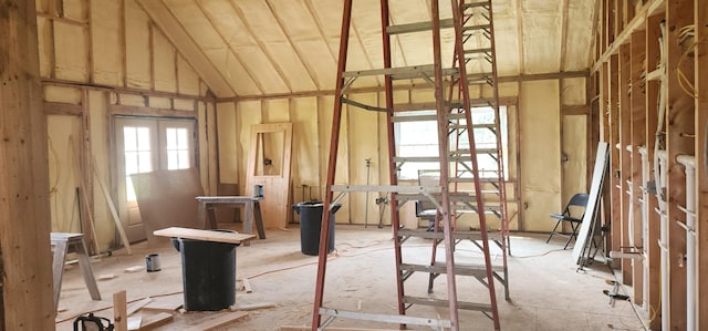 misc room with lofted ceiling