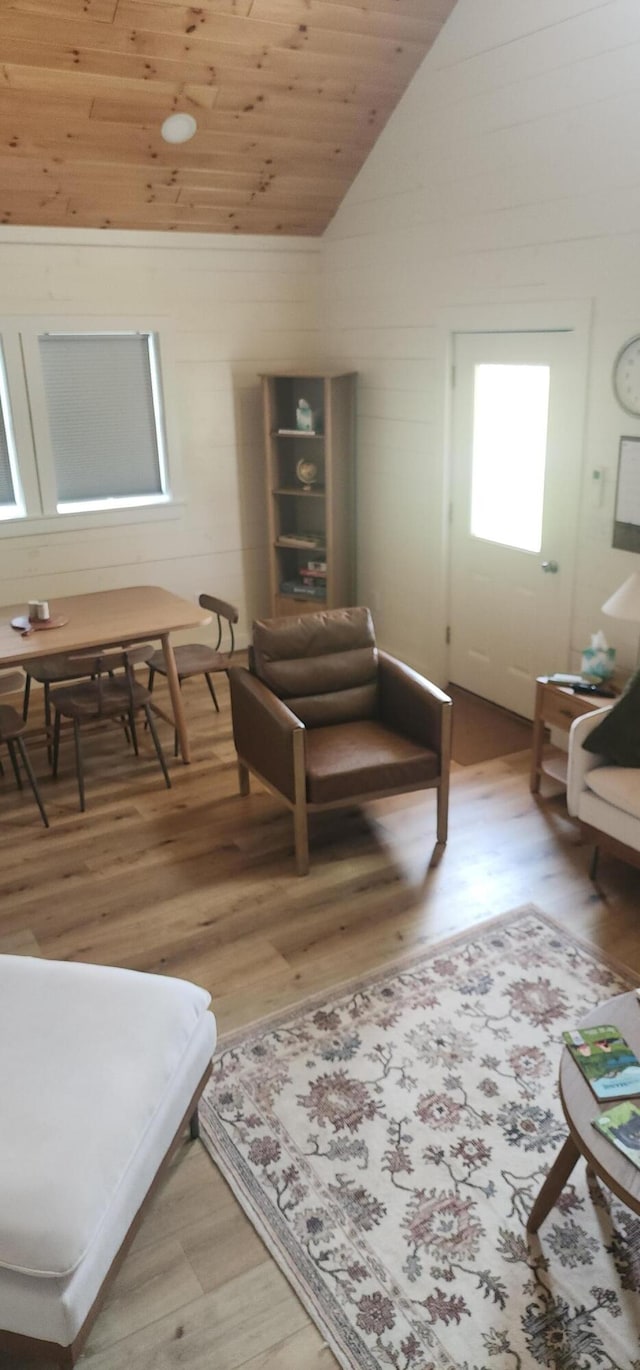 sitting room featuring wooden ceiling, wood-type flooring, and vaulted ceiling