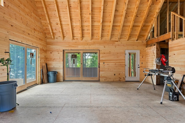 miscellaneous room featuring high vaulted ceiling, beamed ceiling, wood ceiling, and wooden walls