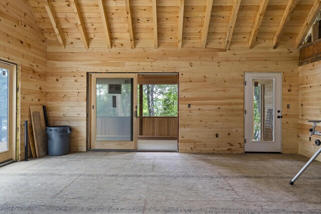 interior space featuring high vaulted ceiling, beamed ceiling, and wooden ceiling