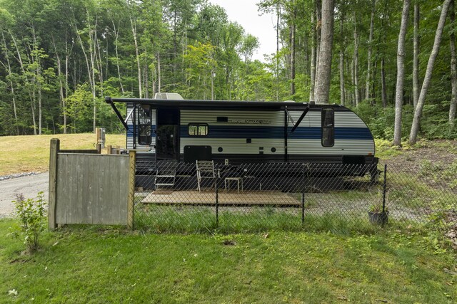 rear view of property with a lawn