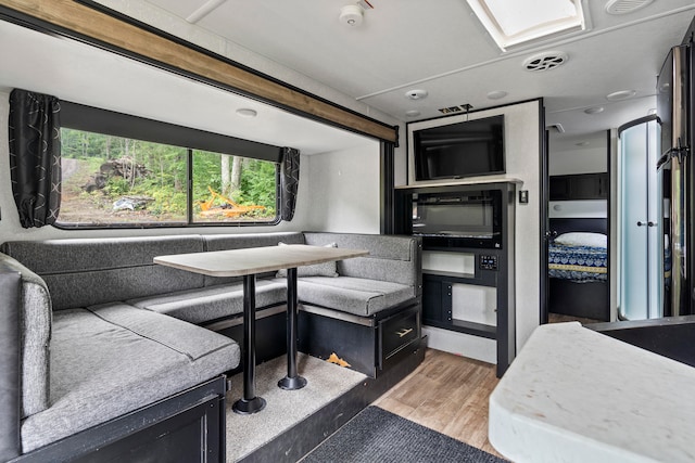 home office featuring hardwood / wood-style flooring and breakfast area