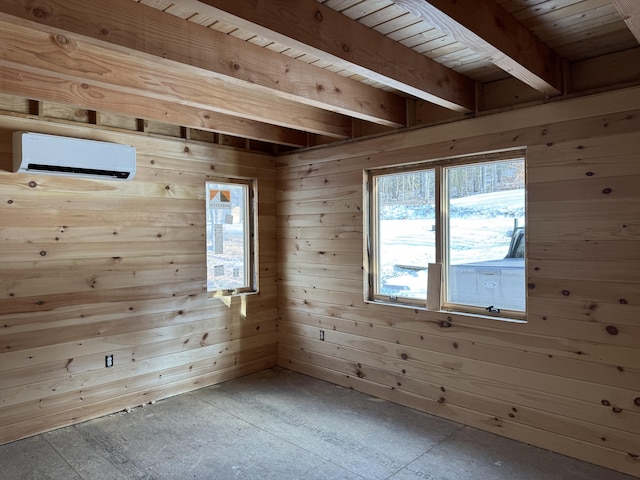 empty room featuring an AC wall unit, beamed ceiling, and wooden walls