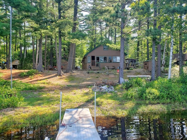 back of house featuring a water view