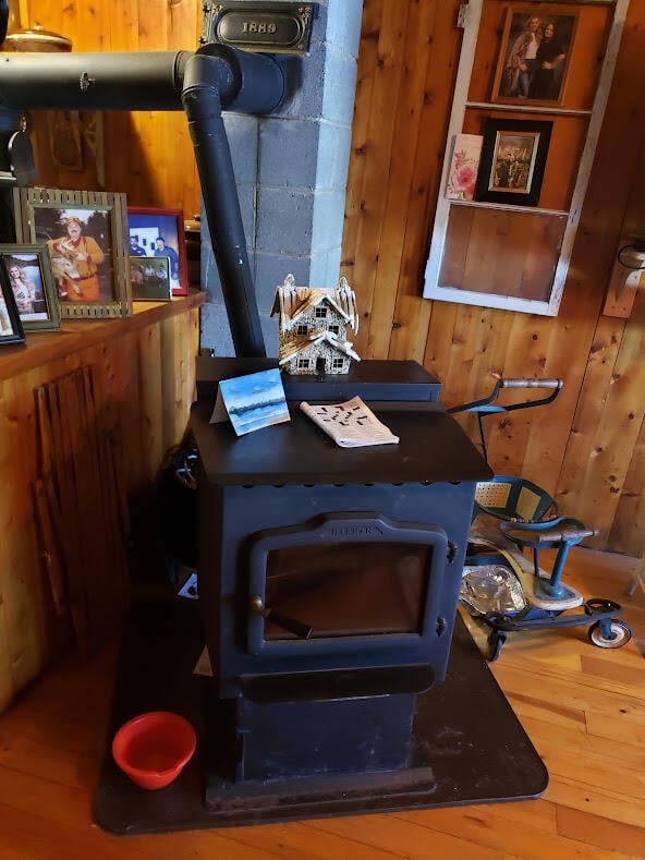 room details with wood-type flooring and wooden walls