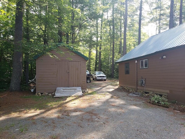 exterior space with a shed