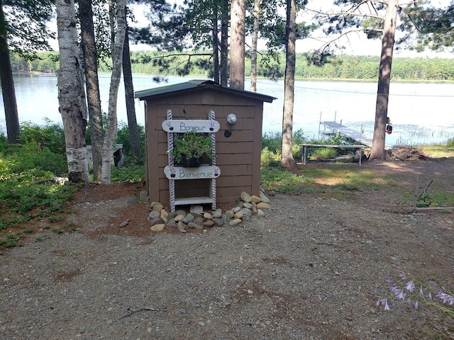 view of outbuilding with a water view