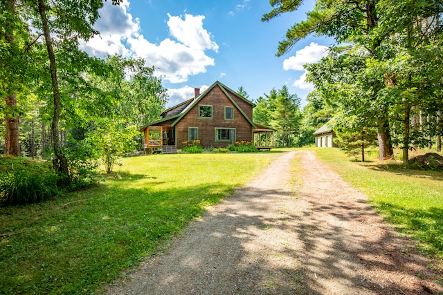 log cabin featuring a front lawn